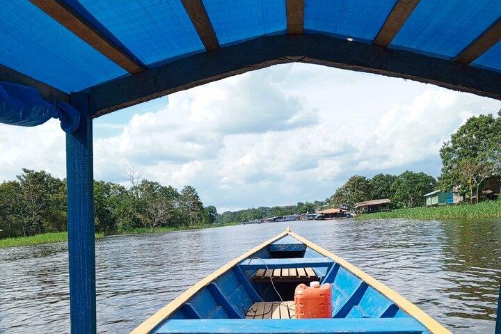 Sunset on the Amazon with fishing and pink dolphin search