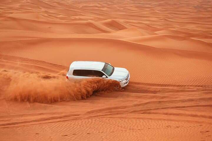 Dubai Desert Safari Dune Bashing, Camel Ride, Sandboarding & BBQ