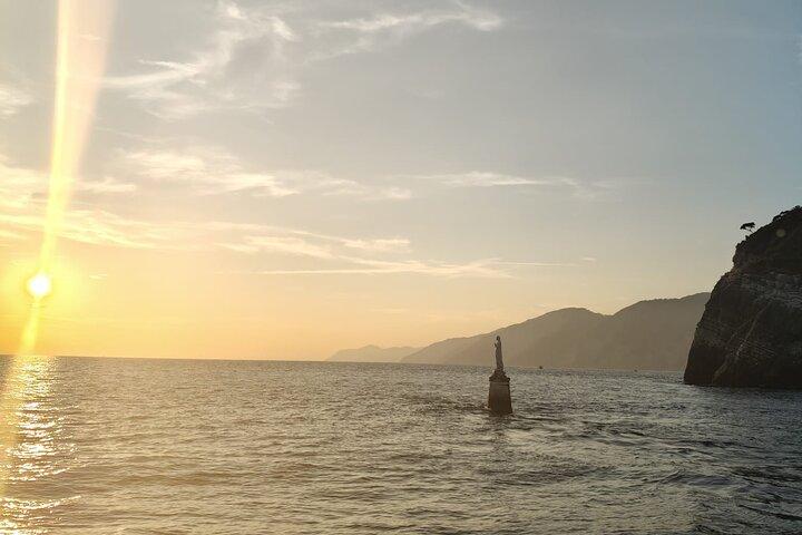 Aperitif on a boat at sunset, Porto Venere and islands