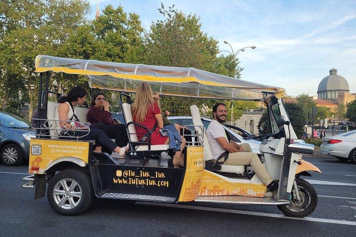 Tour of Historic and Modern Madrid with a guide in a yellow tuk tuk