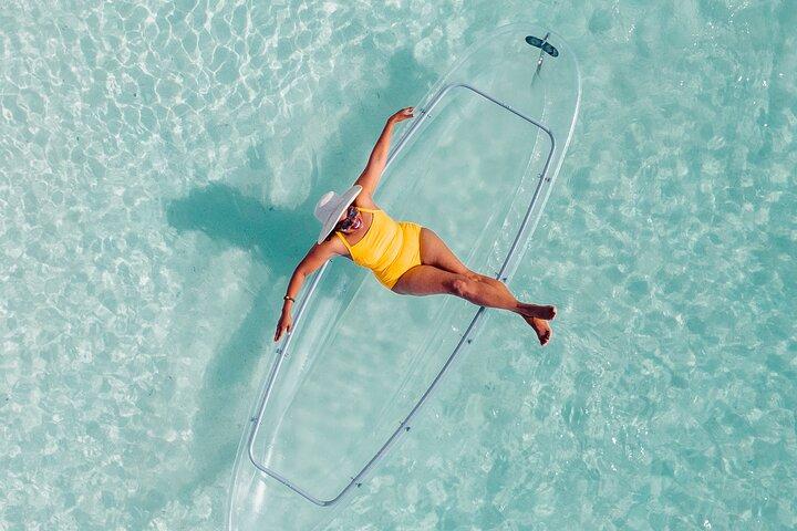 Explore Scenic Water in Transparent Kayak with Drone Footage