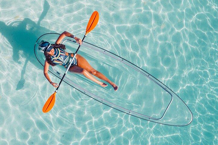 Explore Scenic Water in Transparent Kayak with Drone Footage