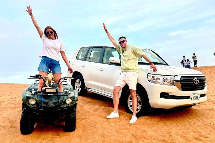 Red Dunes Safari Dubai Quad Bike Camel Ride Sandboard &BBQ Dinner