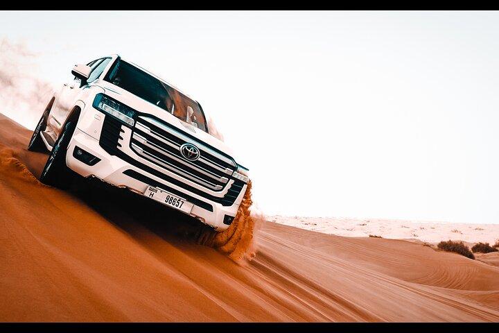 Dubai :-Morning Desert Safari, Quad Bike, Sandboard and Camel.