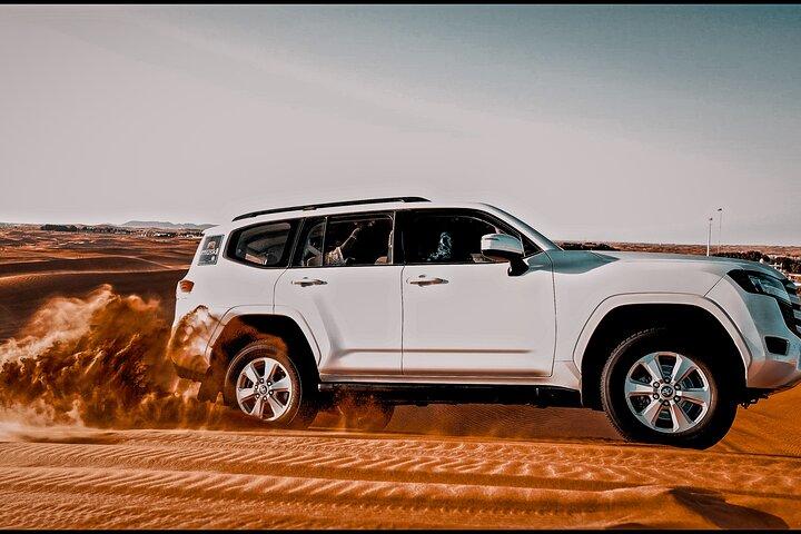 Dubai :-Morning Desert Safari, Quad Bike, Sandboard and Camel.