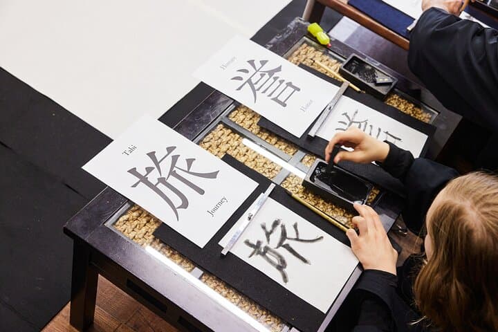 Learning Zen of Japanese Calligraphy in kimono near Osaka Castle