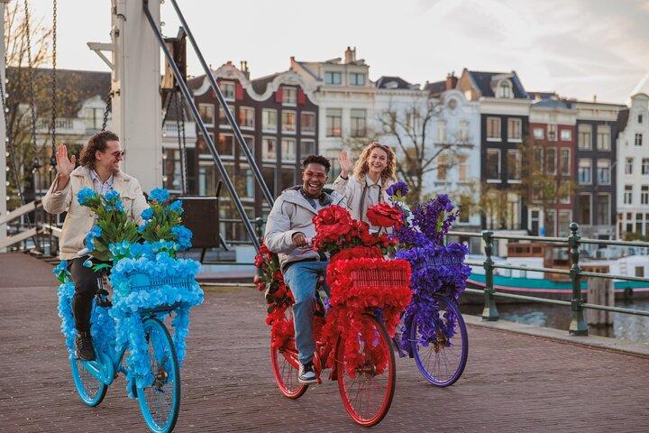Explore Amsterdam canals on iconic Flower Bikes