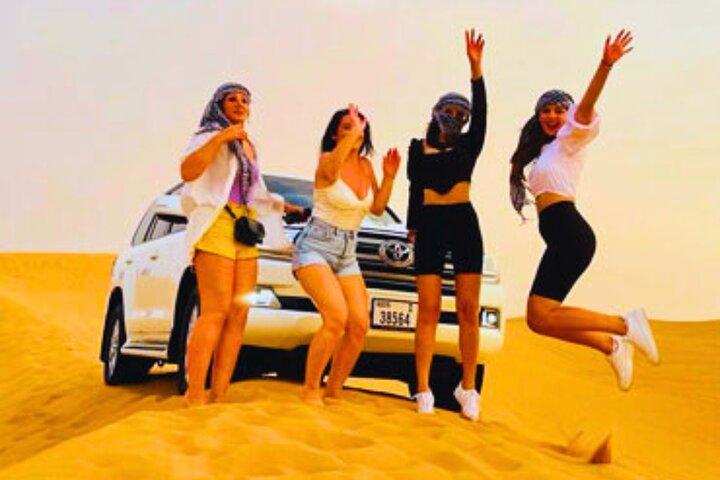 Sunset Evening Desert Safari with Dune Bashing Camel Ride & BBQ