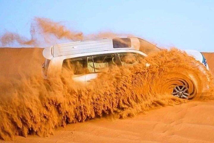 Dubai Desert Safari Camel Ride Dune Bashing BBQ Dinner & Shows