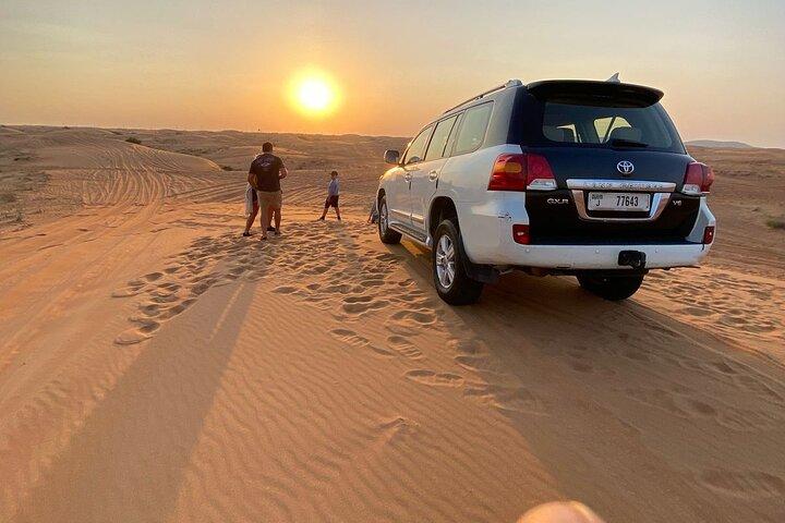 Dubai desert safari with BBQ dinner, camel ride & dune Bashing