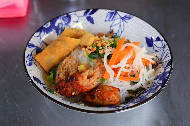 Saigon Night Street Food and City Tour on Scooter