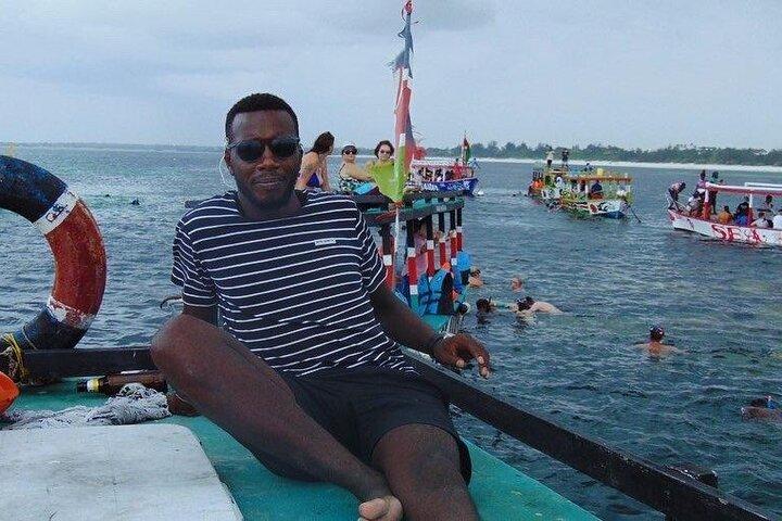 Full-Day Safari Blue Tour with Snorkeling Dolphins & Island Stop