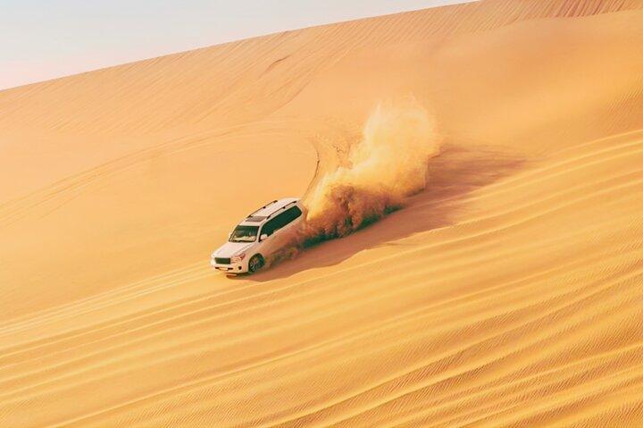 Dubai Half Day Desert Safari With Camel Ride and Quad Bike Option