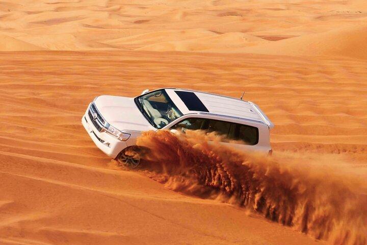 Evening Desert Safari Dubai: Red Dunes, Camel Ride, & BBQ Dinner