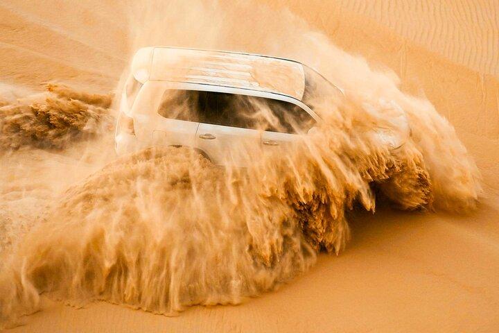 Abu Dhabi Dune Bashing, Sand Surfing, Camel Ride, and BBQ Dinner