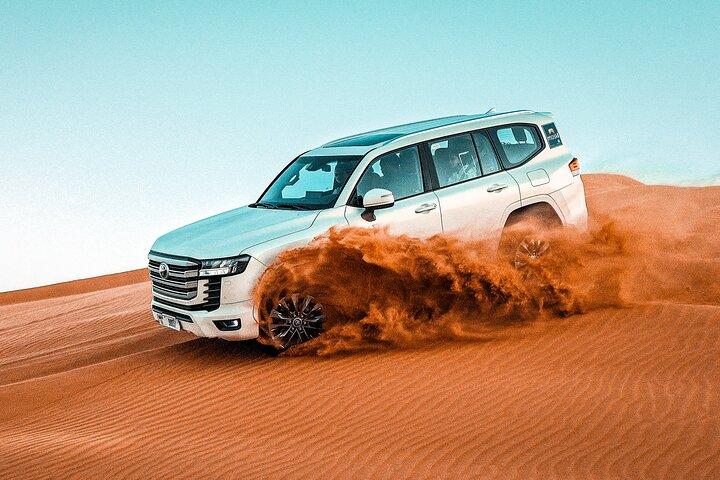 Dubai :-Morning Desert Safari, Quad Bike, Sandboard and Camel.