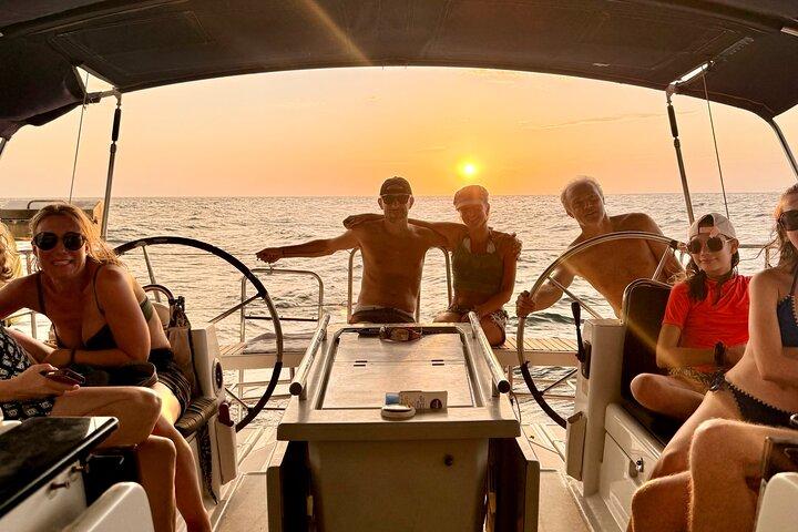 incredible Sunset on Sailboat by Bahí Santa Marta