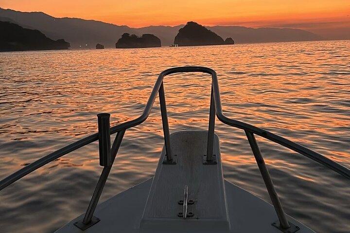 Bioluminescence and sunset by boat to Los Arcos de Mismaloya