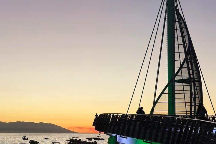 Bioluminescence and sunset by boat to Los Arcos de Mismaloya