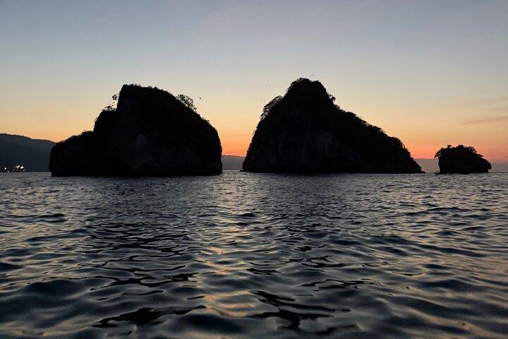 Bioluminescence and sunset by boat to Los Arcos de Mismaloya