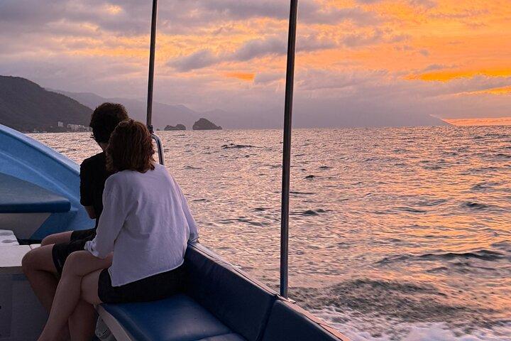 Bioluminescence and sunset by boat to Los Arcos de Mismaloya