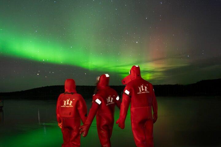 Ice Floating in Forest Lake with Aurora Borealis