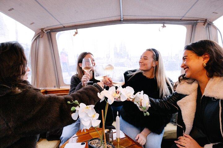 Explore Amsterdam's Canals Aboard a Cozy Small Group Cruise