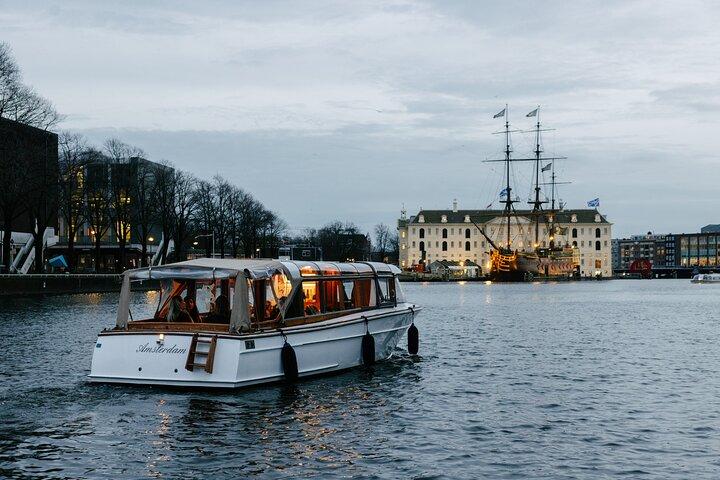 Explore Amsterdam's Canals Aboard a Cozy Small Group Cruise