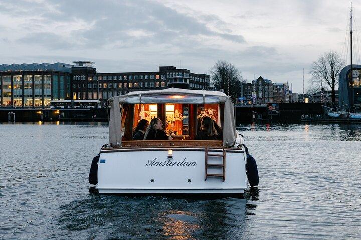 Explore Amsterdam's Canals Aboard a Cozy Small Group Cruise