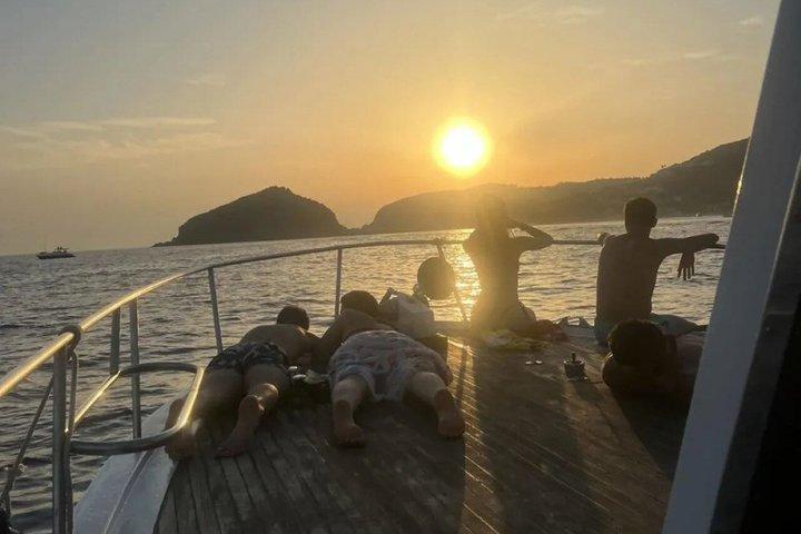 Sunset aperitif on the coast of Ischia by boat with skipper