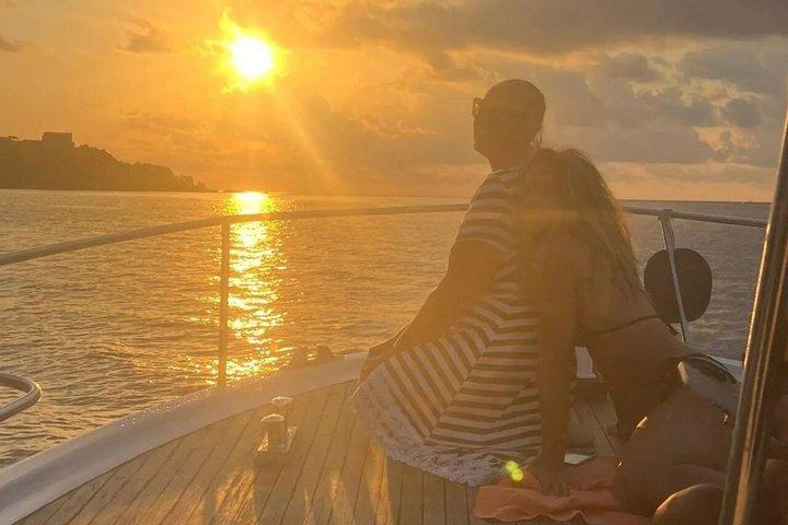 Sunset aperitif on the coast of Ischia by boat with skipper