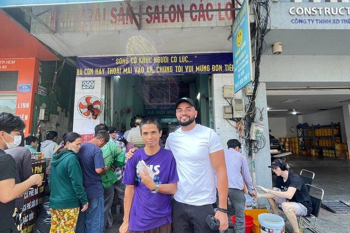 Two Sides of Saigon: Local Life, Markets & Slum Tour by Scooter