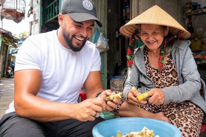 Two Sides of Saigon: Local Life, Markets & Slum Tour by Scooter