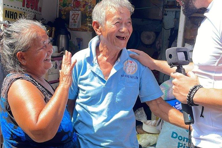 Two Sides of Saigon: Local Life, Markets & Slum Tour by Scooter