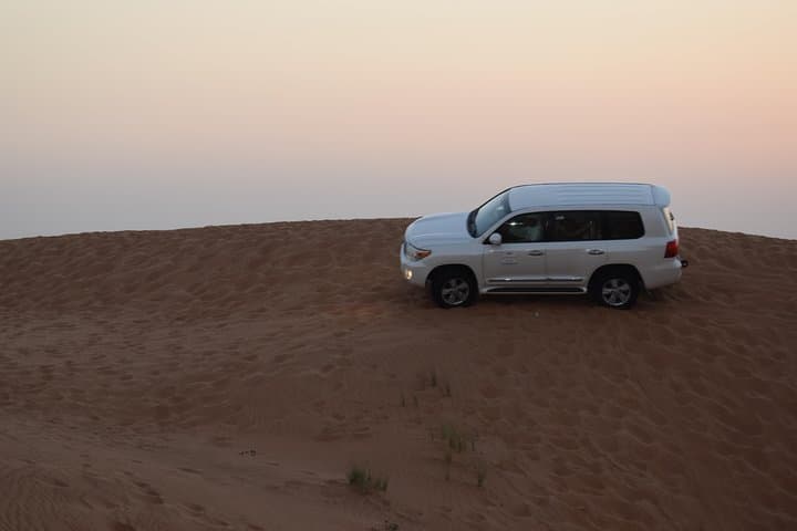 Dune Bashing with Quad Bike and Sand Boarding from Dubai
