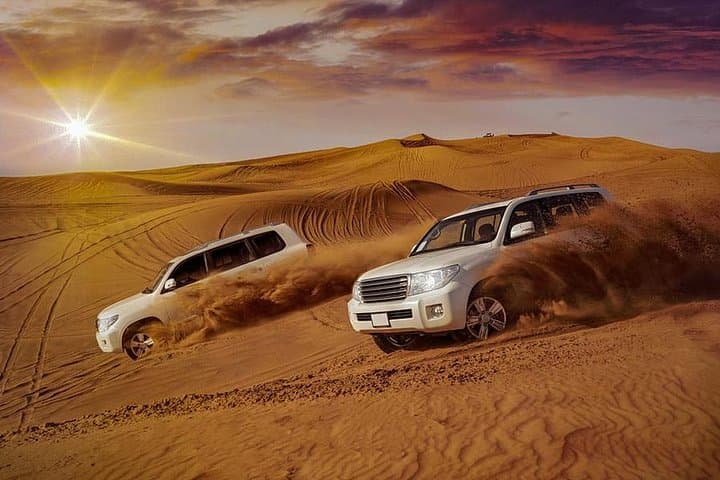 Evening Desert Safari with Camel Ride, BBQ Dinner and Dune Bashing