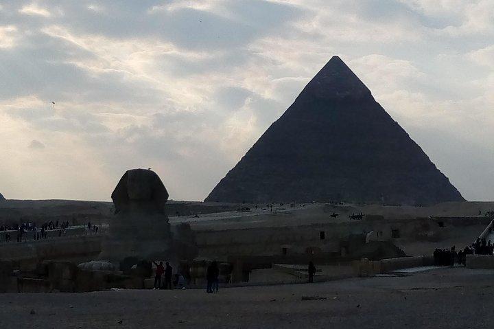Giza pyramids sunset camel ride with local dinner