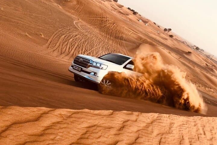 Red Dune Desert Safari with BBQ Dinner, Camel Ride & Live Shows