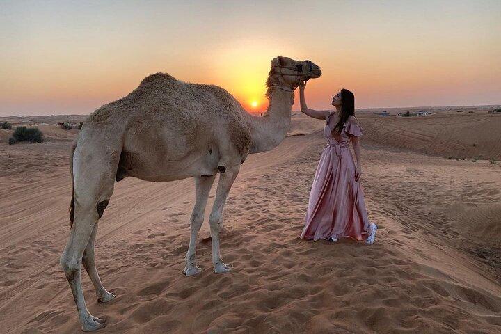 Private Desert Excursion with camel ride Sandboard & BBQ Dinner