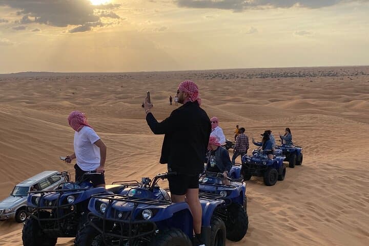 Premium Dubai Red Dunes Quad Bike Tour, Sandboard, Camel & BBQ