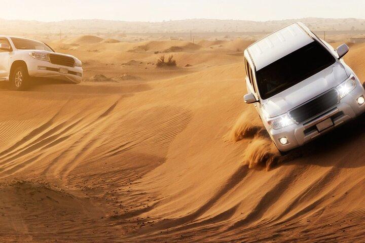Dubai Desert Safari with Dune Bashing, Camel rides & BBQ Dinner