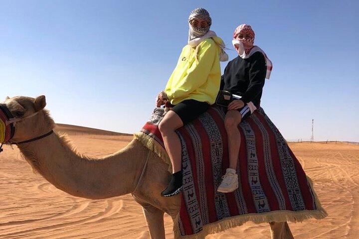 One hour Quad Bike at Red Sand Desert Safari with Camel Ride and BBQ Dinner