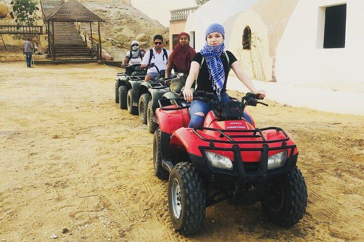 ATV ride at the desert of GIZA pyramids at sunrise or sunset