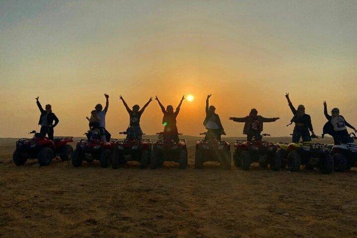 ATV ride at the desert of GIZA pyramids at sunrise or sunset