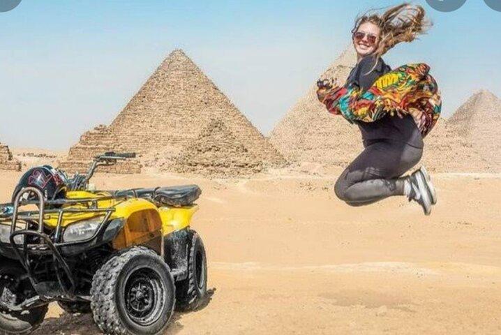 ATV ride at the desert of GIZA pyramids at sunrise or sunset