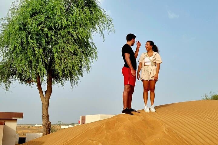 The Ghost Village Safari Tour with Dune Bashing and Sandboarding