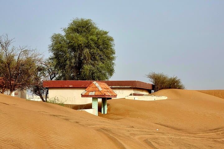 The Ghost Village Safari Tour with Dune Bashing and Sandboarding