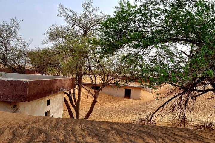 The Ghost Village Safari Tour with Dune Bashing and Sandboarding