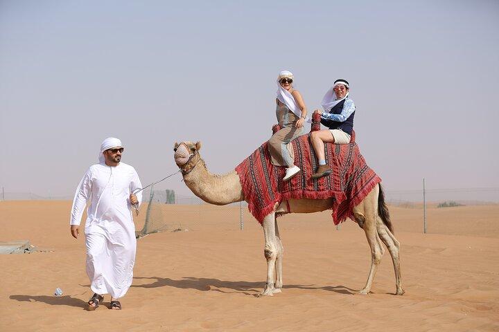 Dubai Desert Safari with Quad Bike, Dune Bashing, Camel Ride, Sand Boarding &BBQ