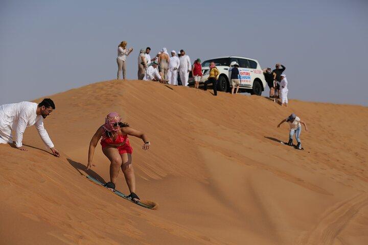 Dubai Desert Safari with Quad Bike, Dune Bashing, Camel Ride, Sand Boarding &BBQ
